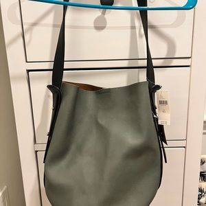 Medium tote bag. Anthropologie brand new with tags. blueish/gray fake leather.
